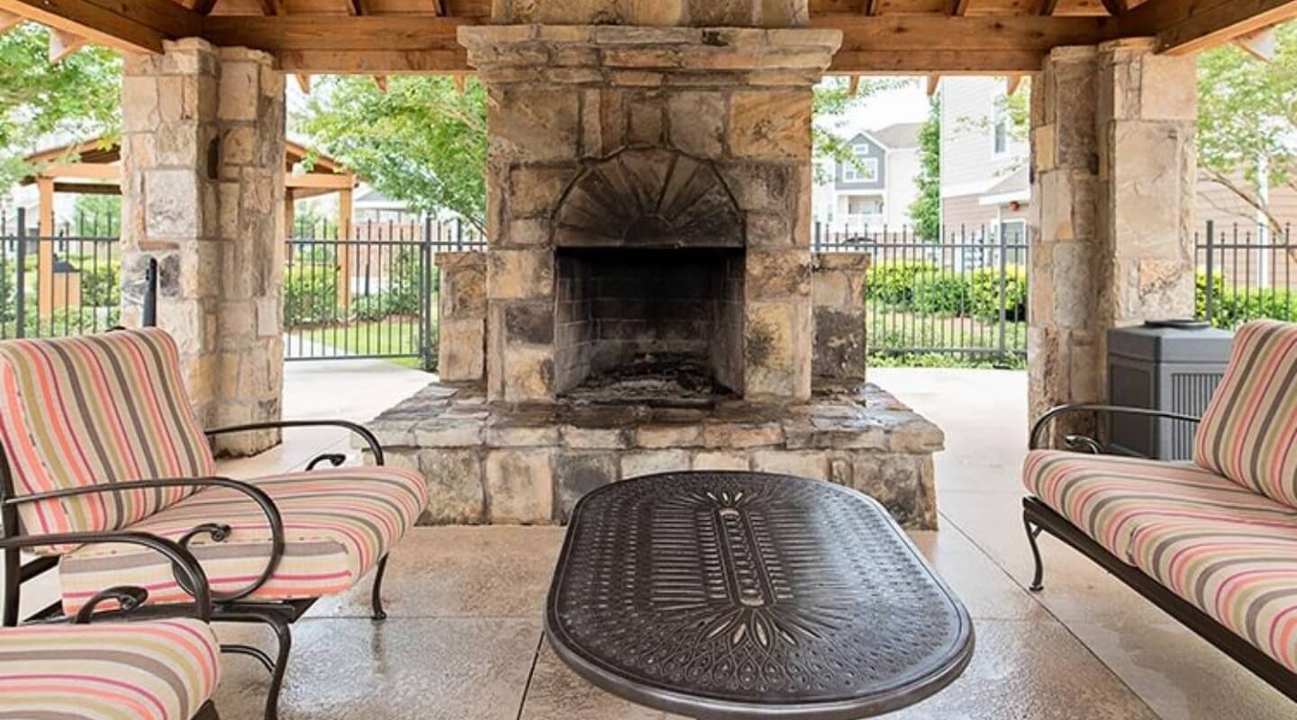 outdoor seating with a fireplace
